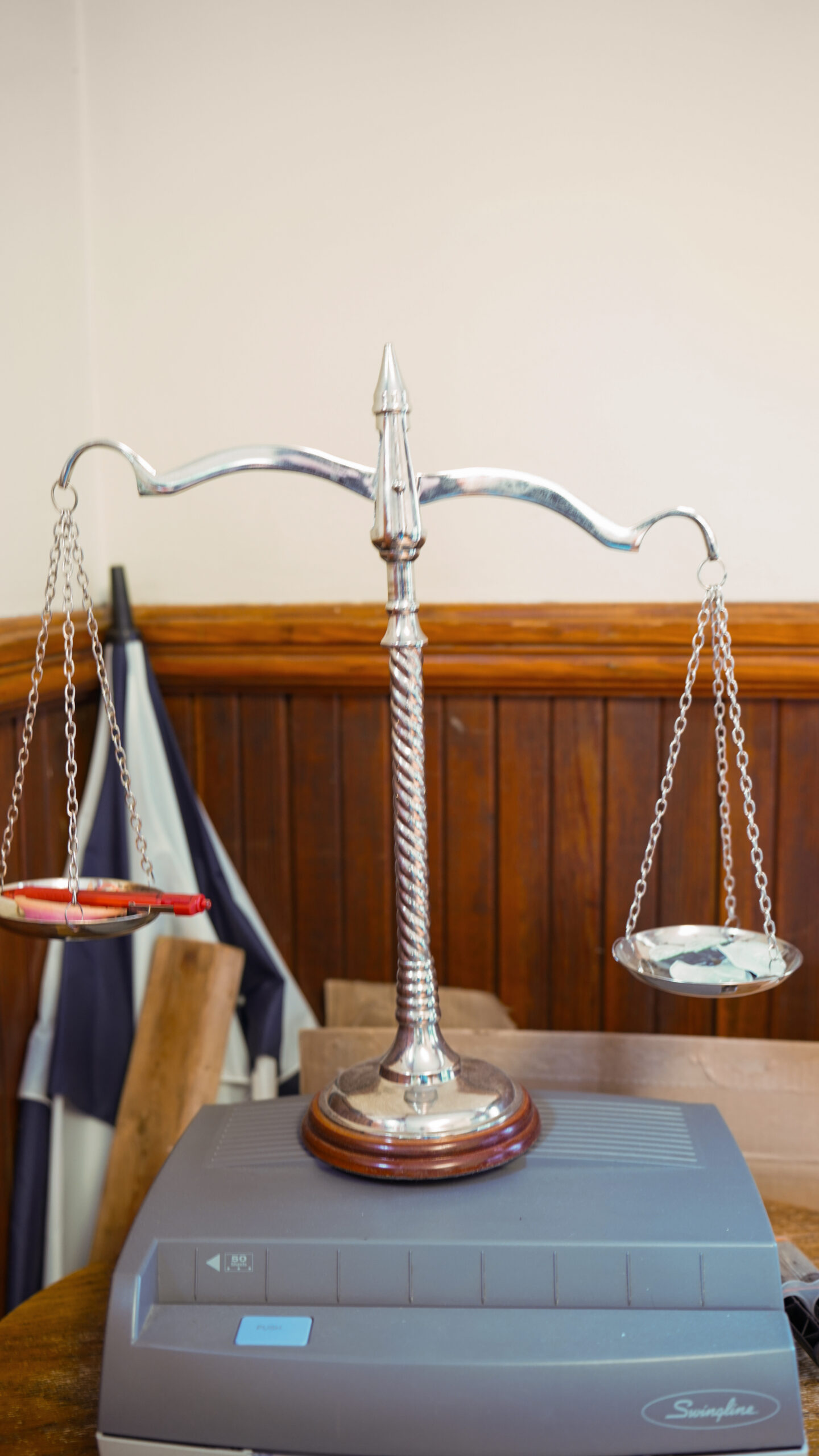 A diverse group of four professionals collaborating at a desk in a modern office.