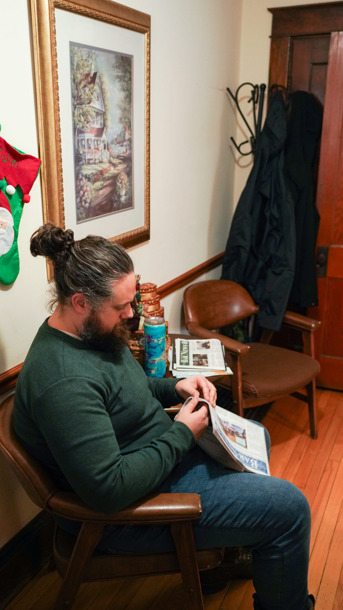 A diverse group of four professionals collaborating at a desk in a modern office.